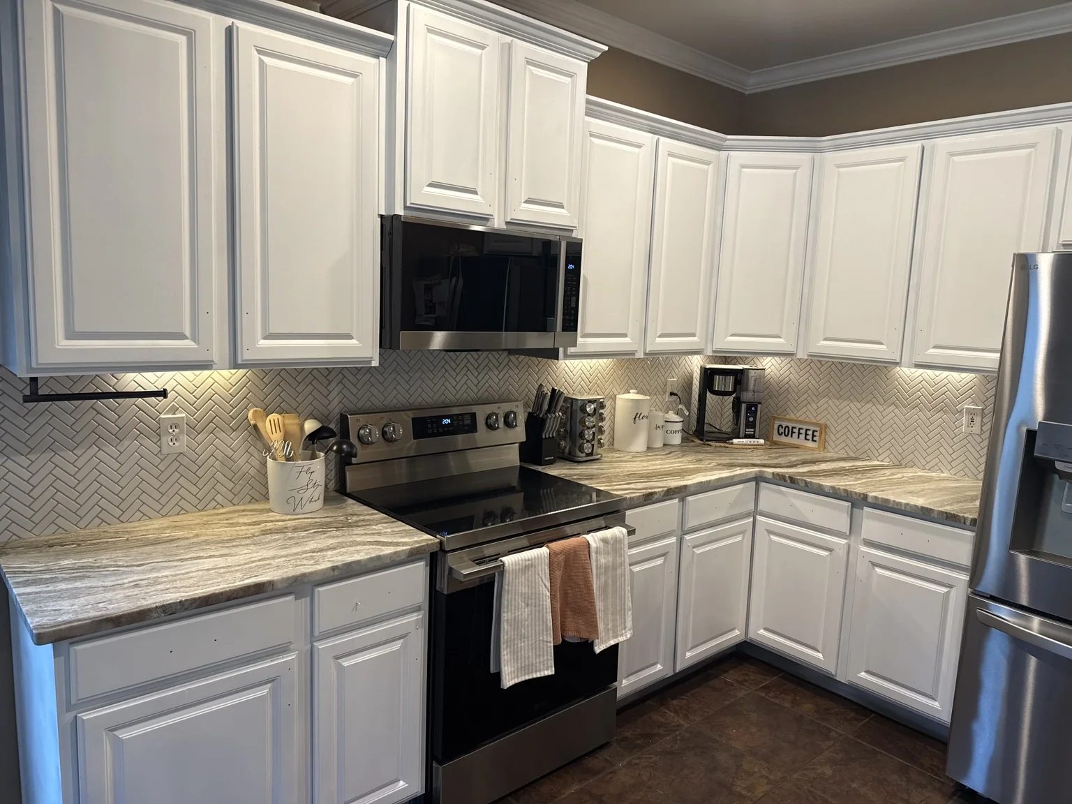 Cabinet refinishing and interior finish upgrade.