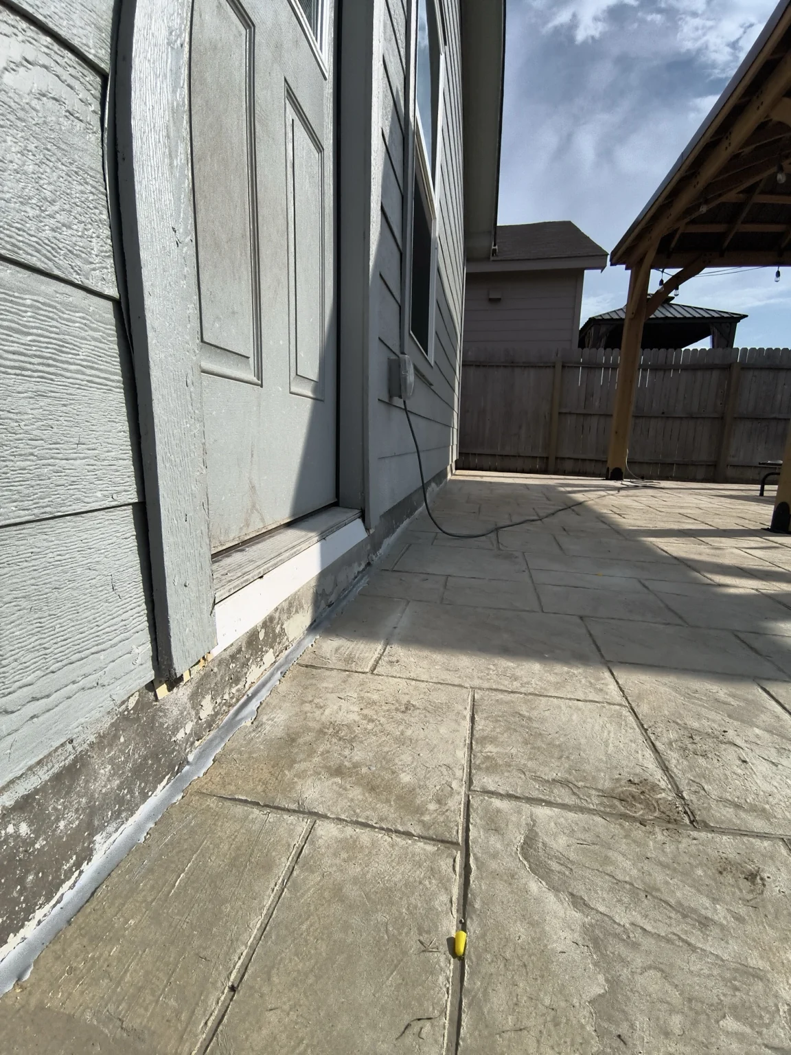 Completed controlled joint with backer material and concrete-compatible sealant.