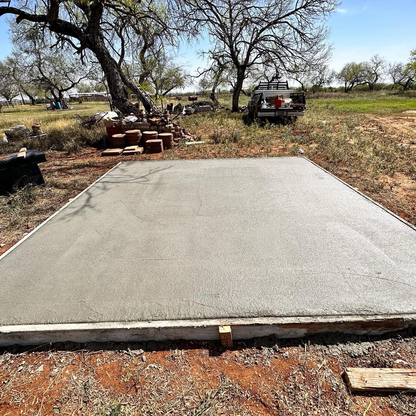 Standalone rectangular concrete pad with fresh finish.