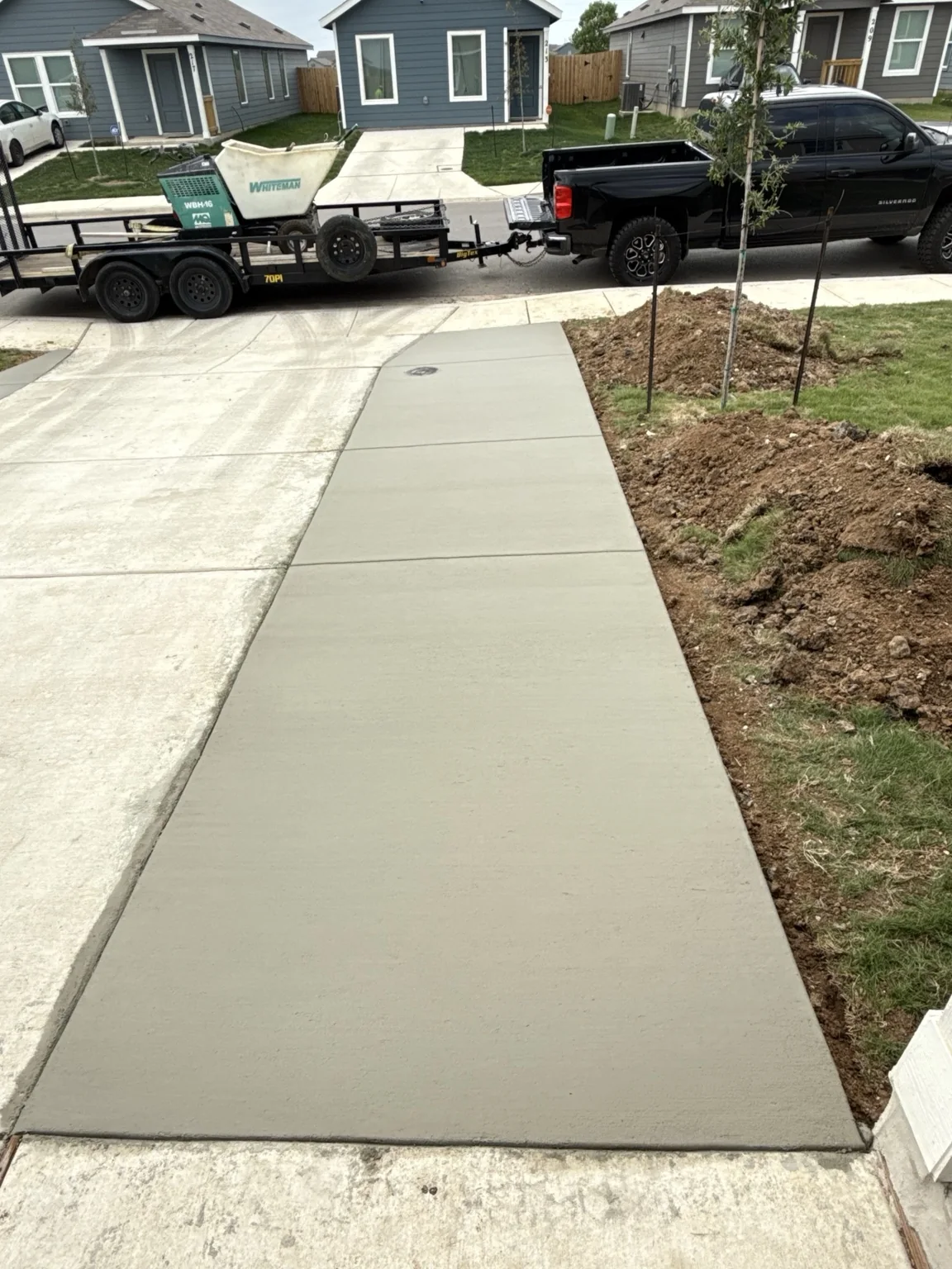 Residential walkway and driveway extension concrete work.