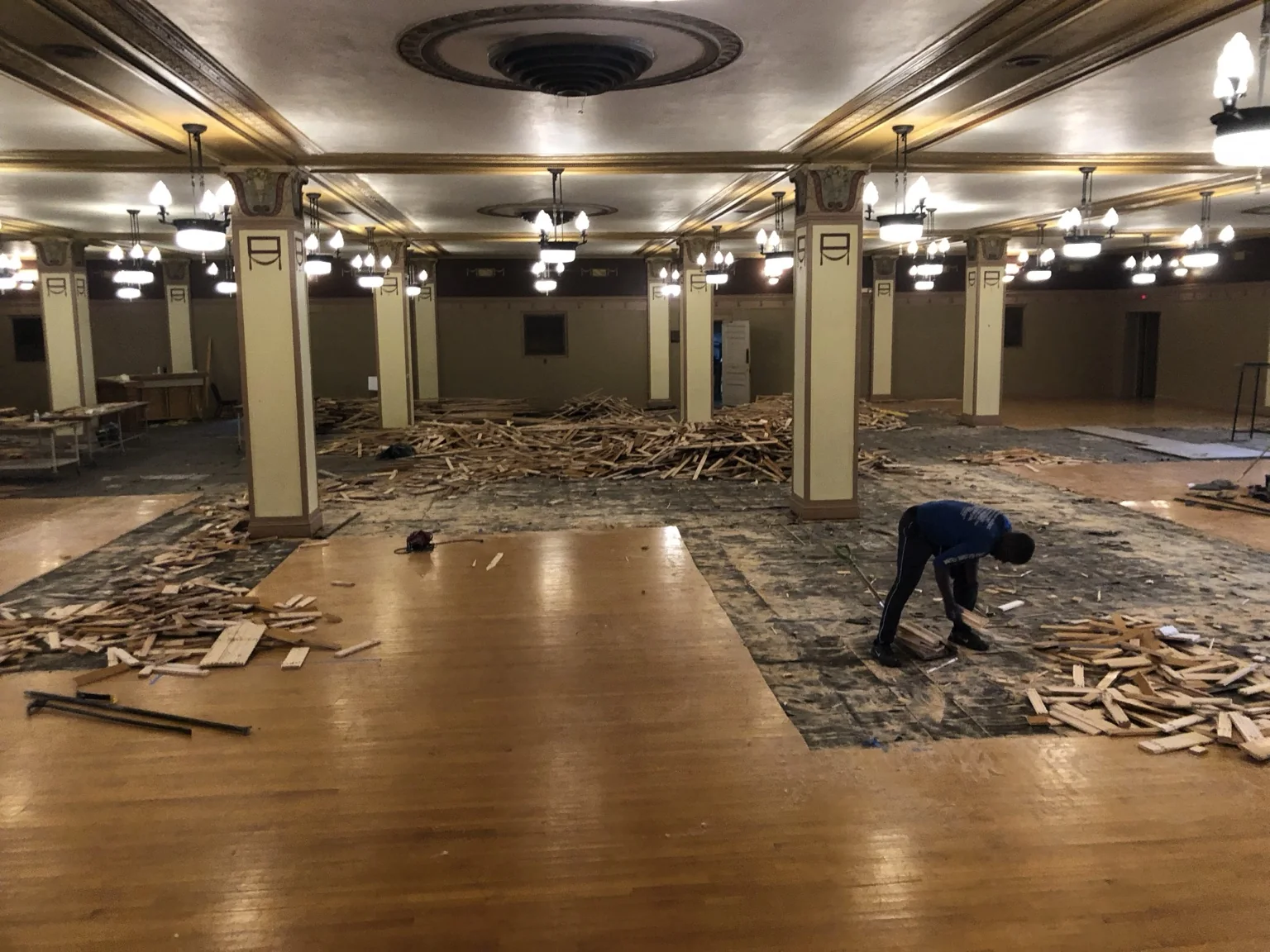 Selective hardwood demolition and salvage underway in the historic assembly hall.