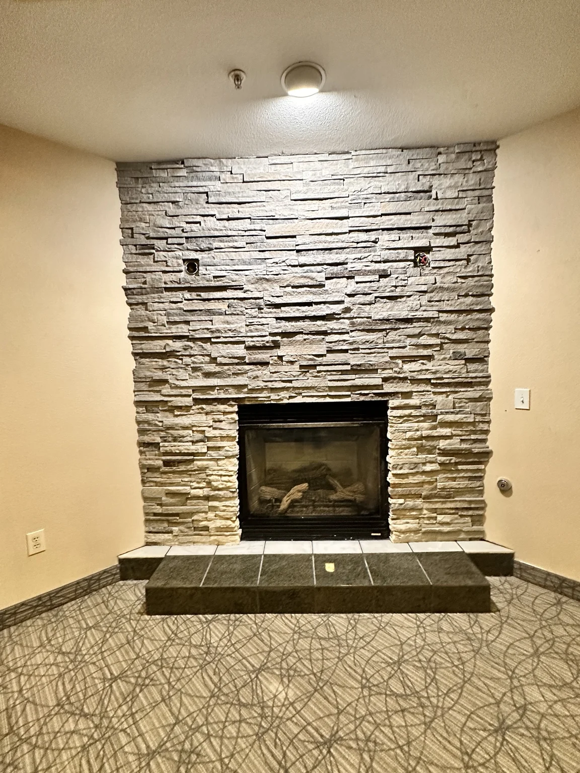 Phoenix Phase 2 cultured-stone fireplace installation.