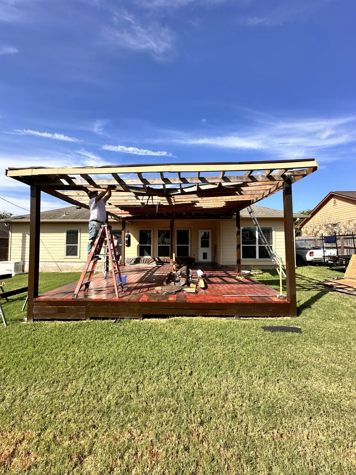 Existing homeowner-attempted roof construction opened during takeover and corrective work.
