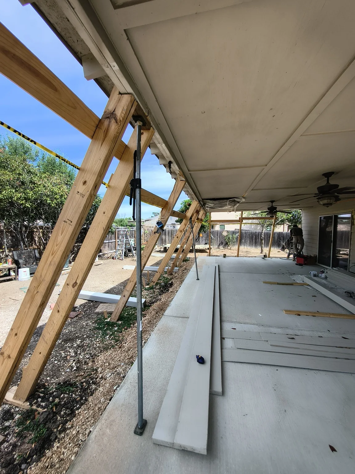Later-stage reconstruction of the patio structure and support conditions.
