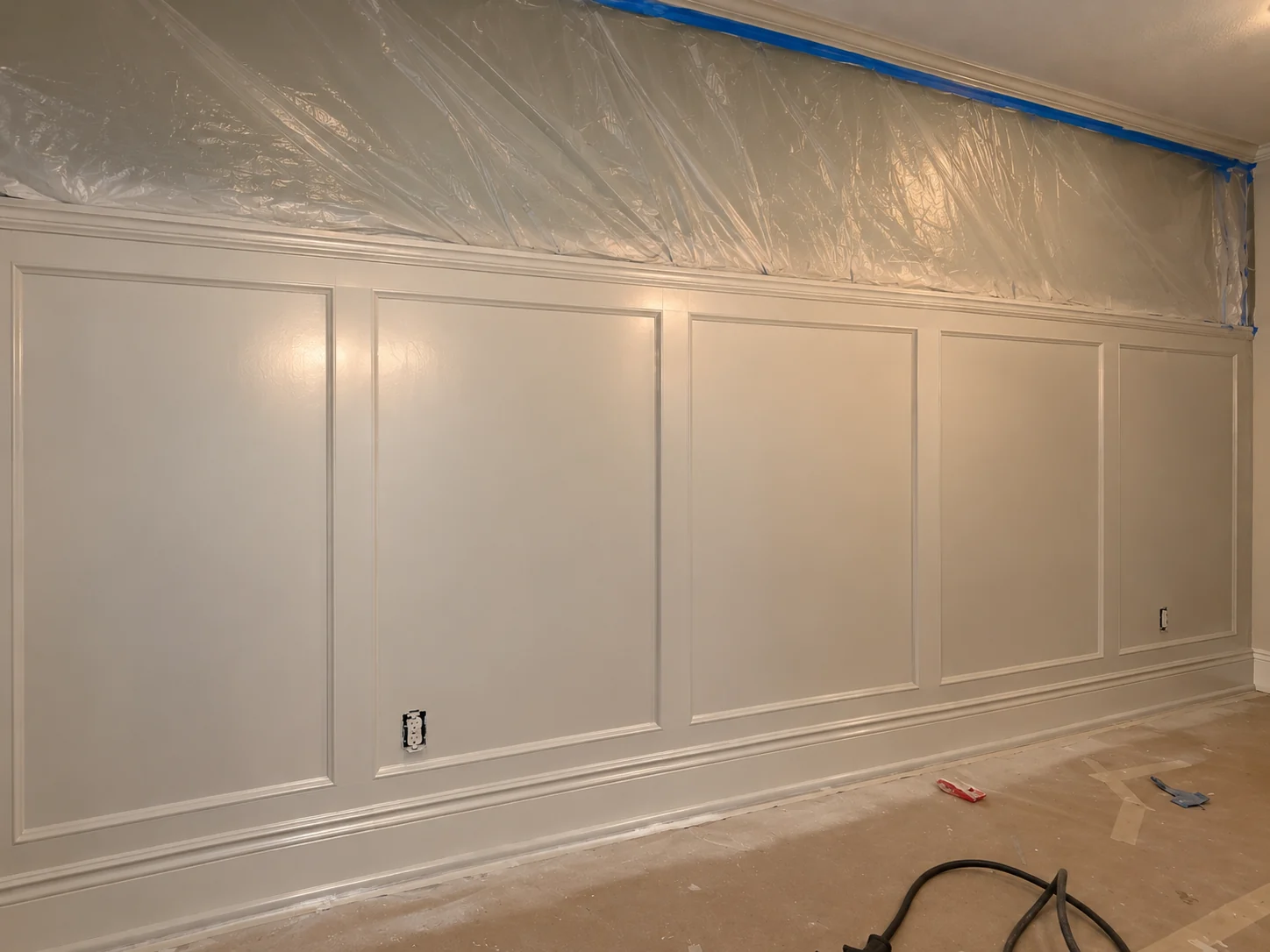 Custom wainscoting and architectural finish work during the finishing phase.